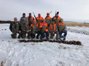 Hunting group posing outdoors